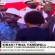 Shock as Kibaki’s Grandson Refuses to Greet Raila at Burial, Hides His Face From Him