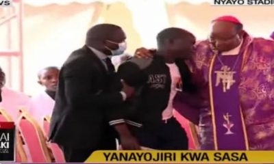 Bishop Muheria Saves Man From Dog’s Beating After Interrupting Kibaki State Funeral