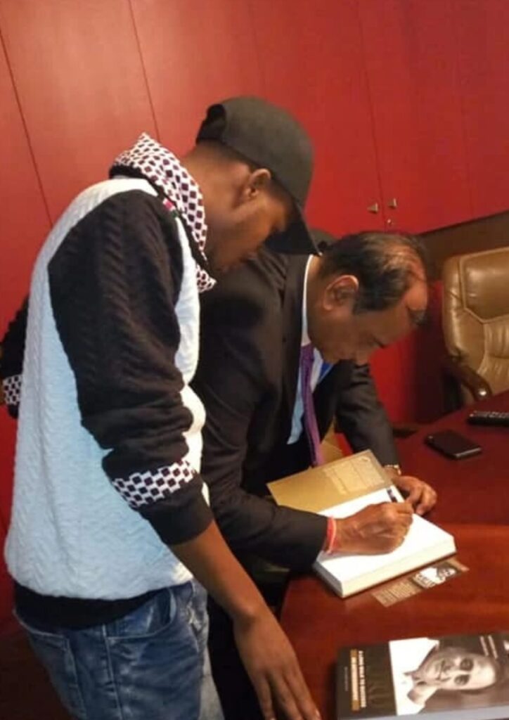 Naftal Mogire with industry partner, reflecting Naftunes Productions’ collaborations.