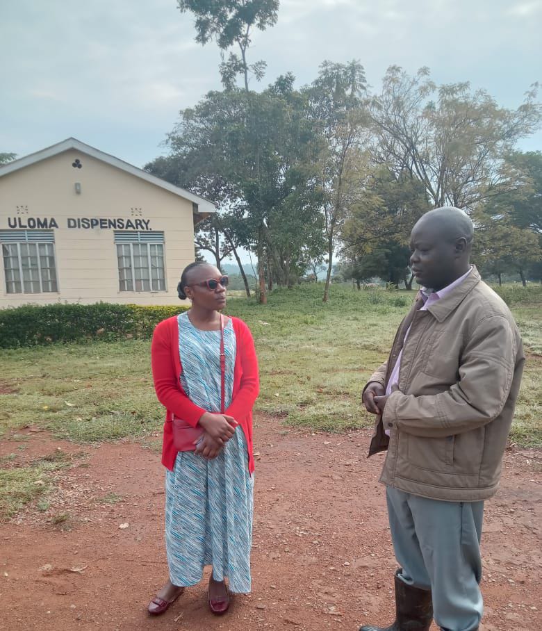 Hon. Lillyanne Aketch standing at Uloma Dispensary in Ugunja Constituency, showing her commitment to improve healthcare facilities and security.