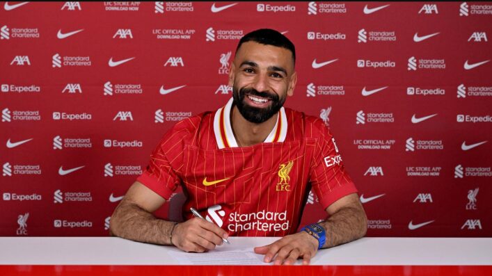 Mohamed Salah signing his Liverpool contract extension in April 2025.