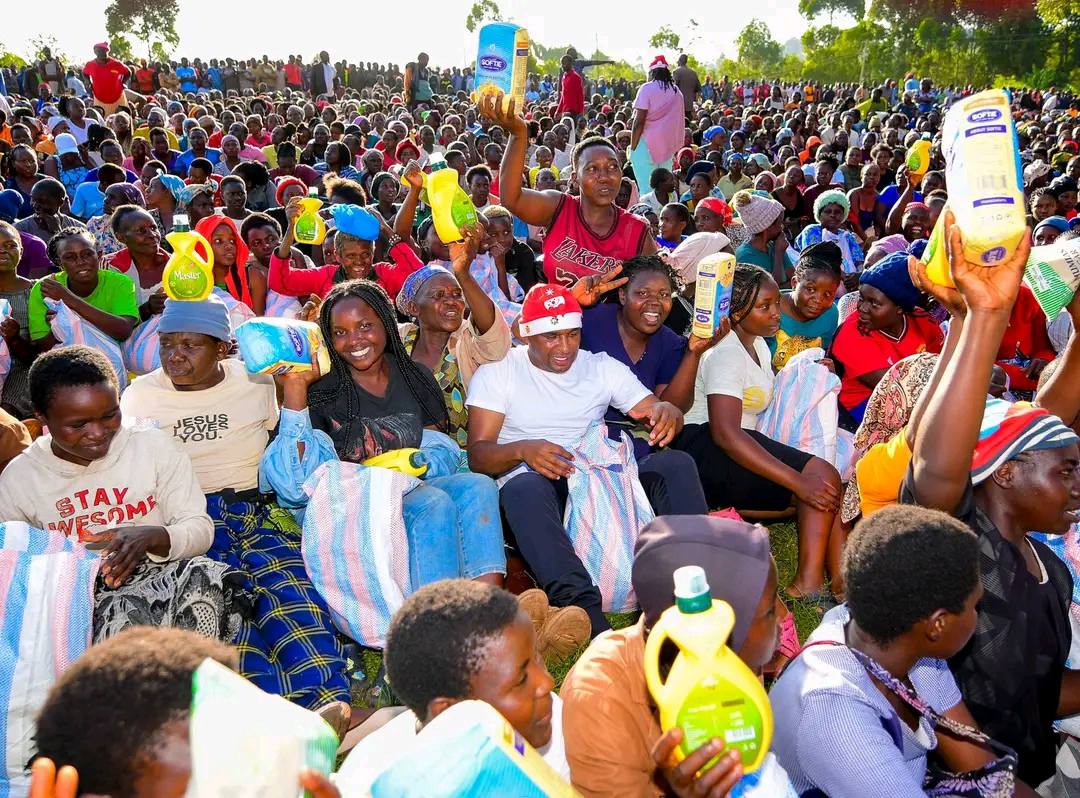 Nyaribari Chache MP Zaheer Jhanda distributing food items to residents, as questions grow over long-term development and bursary support.